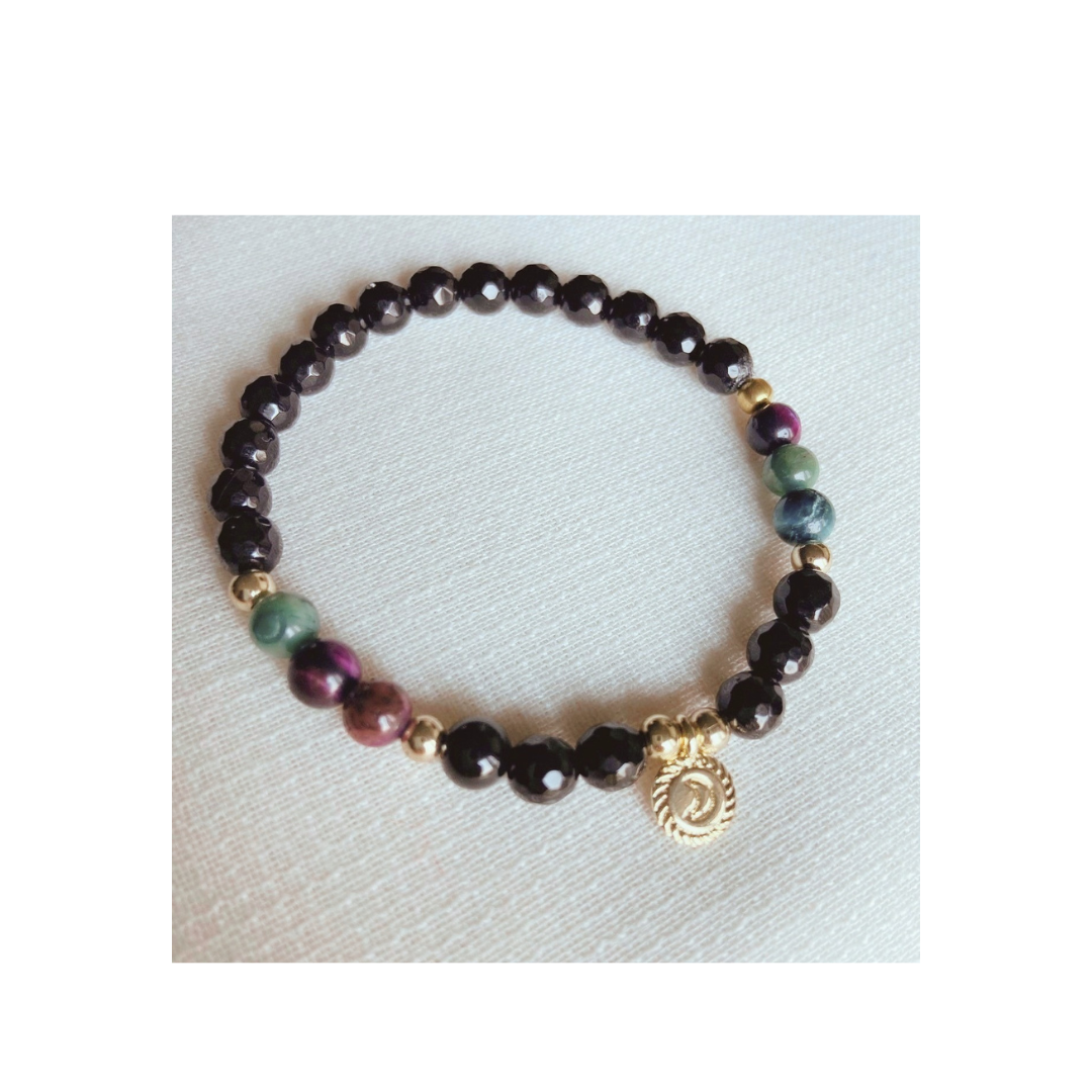 Faceted obsidian bracelet with tiger's eye and vintage gold crescent charm