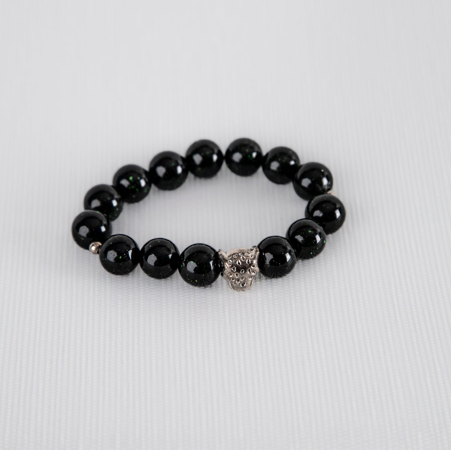 Blue sandstone bracelet with silver cheetah charm