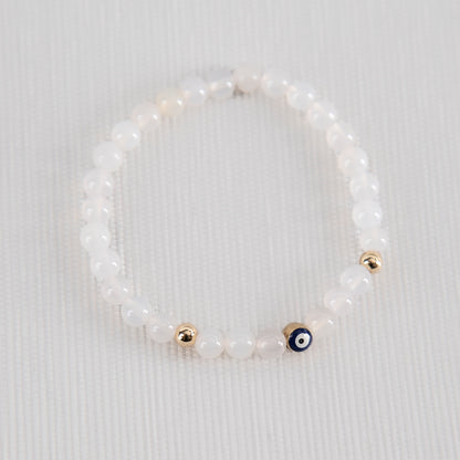 White jade with evil eye charm