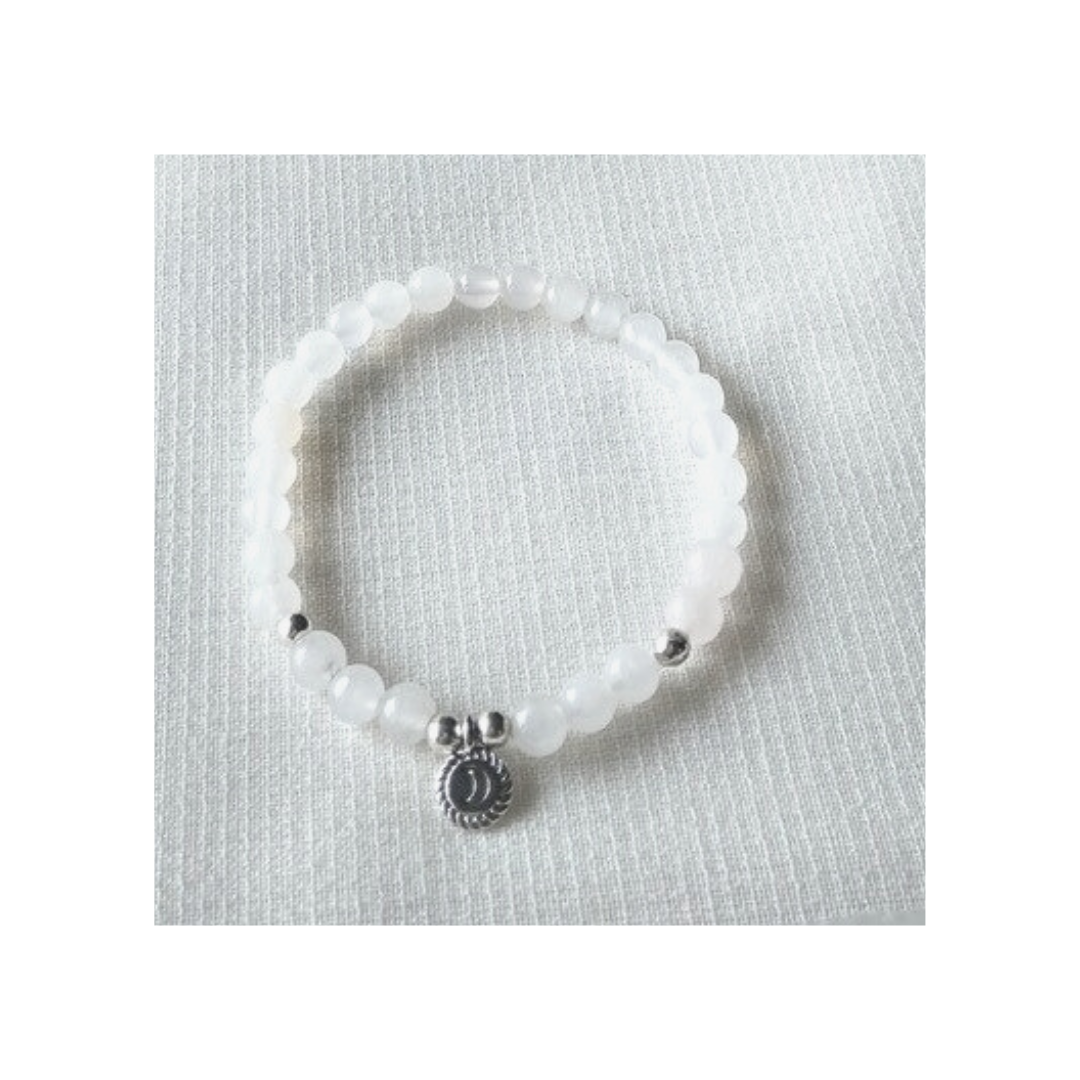 White quartz bracelet with silver crescent moon charm