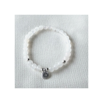 White quartz bracelet with silver crescent moon charm