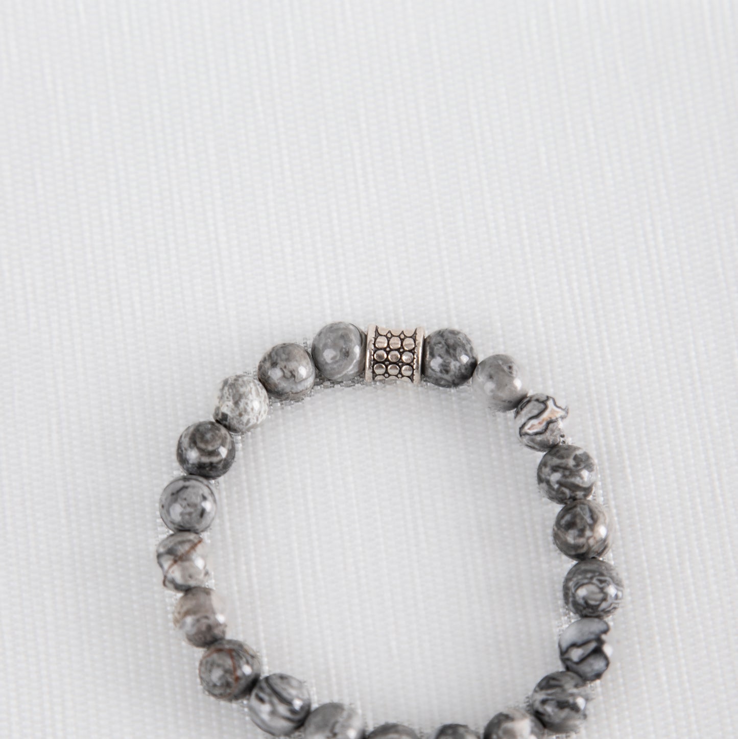 Grey jasper bracelet with silver charm