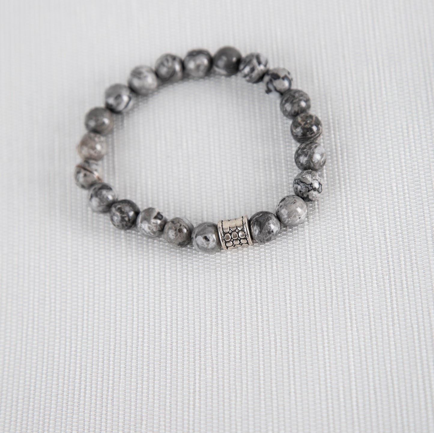 Grey jasper bracelet with silver charm