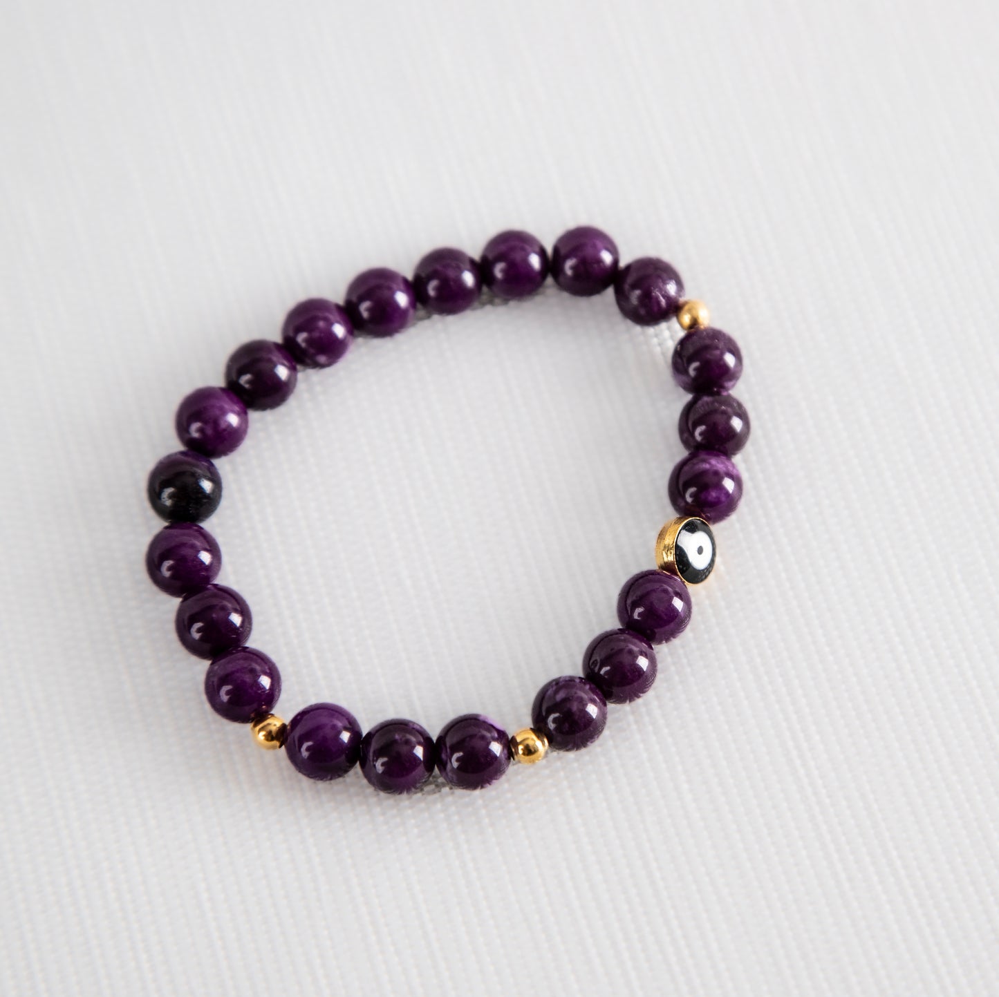 Purple tiger's eye with evil eye charm