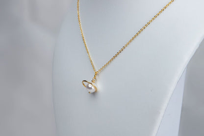 Pearl saturn necklace